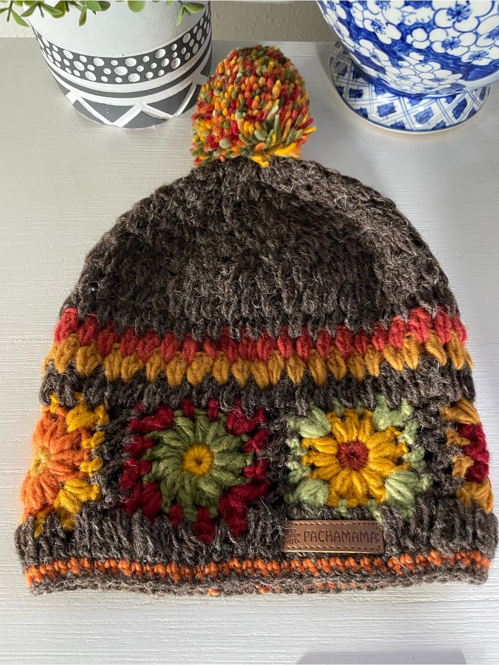 Pachamama Women Wool Beanie Bobble Hat Fleece Lined Hand Crocheted Flower Patter